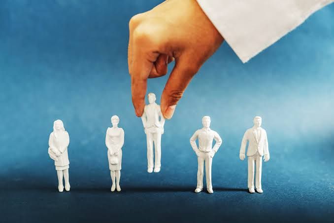 Luca Ferrari, CEO of Bending Spoons, stands in a modern office space while discussing his data-driven hiring process.