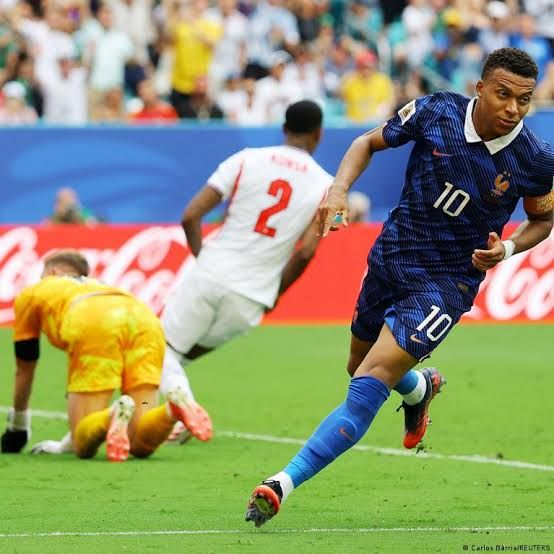 Kylian Mbappe celebrates after scoring during the 2026 World Cup bronze final match between France and England in Miami.