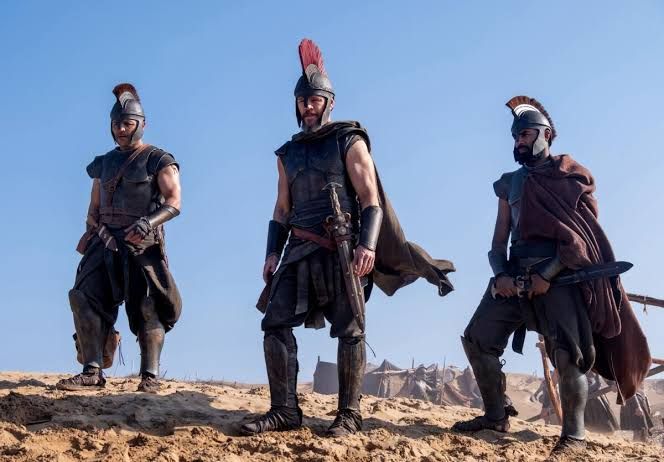 Jimmy Gonzales, Matt Damon, and Himesh Patel dressed as Trojan soldiers in The Odyssey.