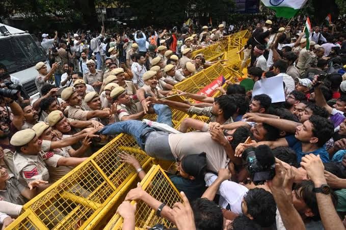 Supporters of the Cockroach Janta Party clash with police while marching toward India's Parliament in New Delhi.